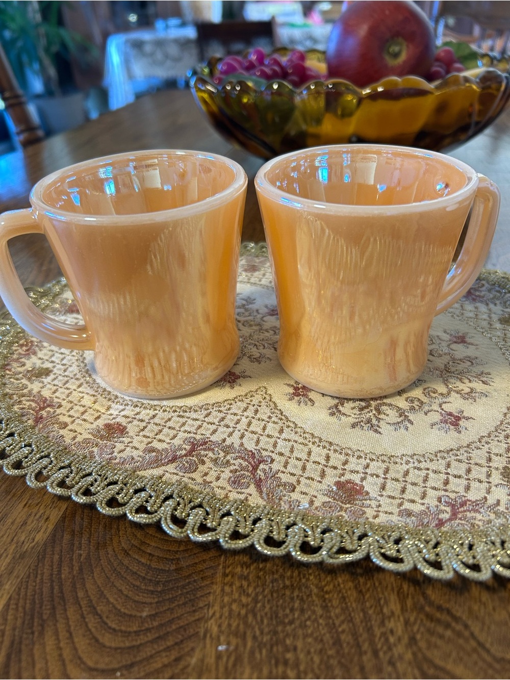 A pair of vintage Anchor Hocking Fire-King peach lustre D-handle mugs.